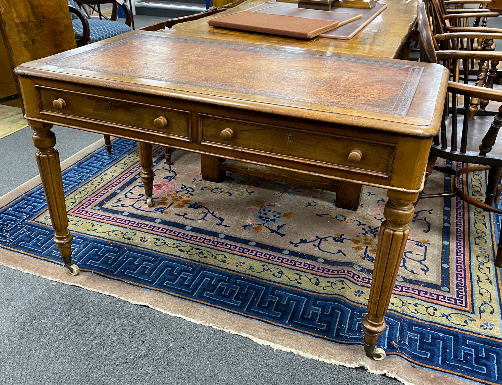 A Victorian mahogany two drawer writing table, width 122cm, depth 68cm, height 77cm